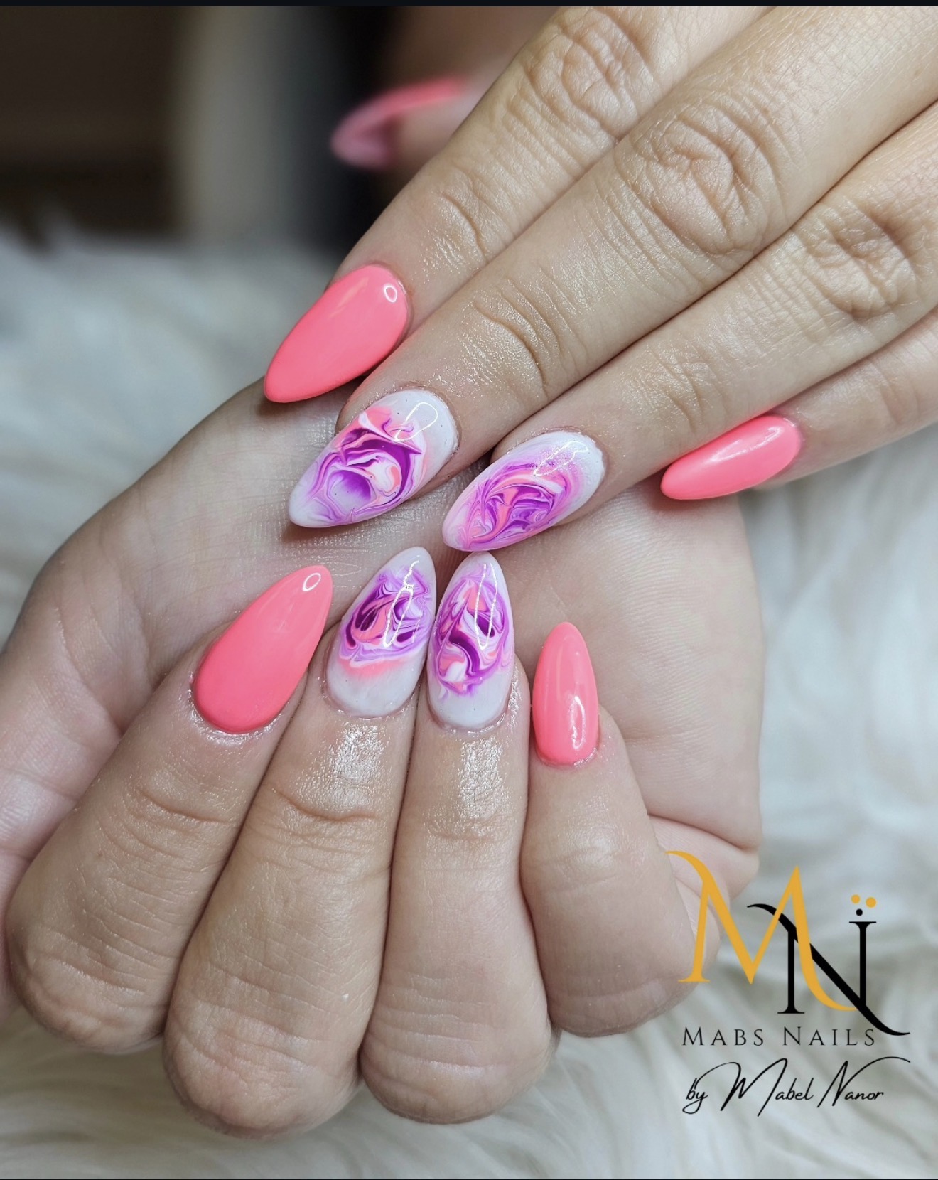 Coral pink nails with marble accent
